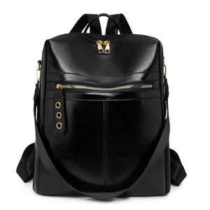 Glossy black backpack with gold zippers and detachable shoulder strap on white background