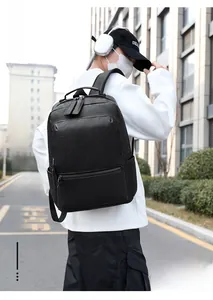 Business laptop backpack in black leather texture featuring large main pocket and side view