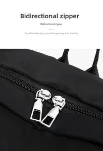 Detail of high-quality bidirectional metal zippers on black oxford fabric backpack