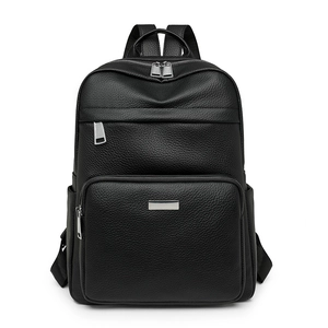 Front view of a black pebbled leather backpack with silver zippers and large front pocket