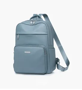 Detail view of light blue lychee pattern leather backpack with silver metal zippers