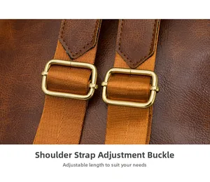 Detail of adjustable shoulder straps with gold metal buckles on brown leather backpack