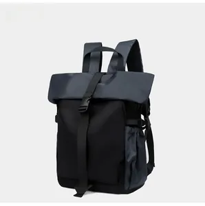 Detail view of the roll-top buckle closure and side mesh pocket of this cycling backpack