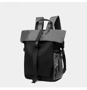 Detail view of the roll-top buckle closure and honeycomb textured fabric of this cycling pack