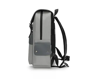Side view of waterproof grey canvas backpack with metal buckles and breathable mesh back