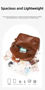 Detailed top view of brown vintage leather backpack showing organized interior storage capacity
