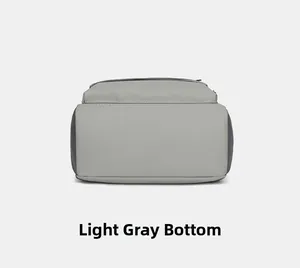 Detail view of the light grey backpack bottom showing durable fabric and stitching
