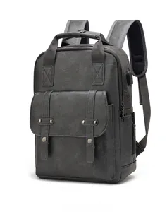 Detail of dark grey faux leather backpack with荔枝 texture and external USB port