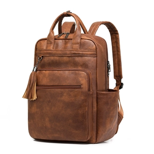 Retro brown PU leather backpack with large capacity and stylish tassel accessory
