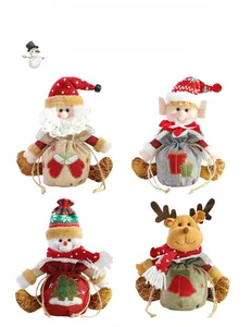 Detailed view of Christmas burlap gift bags featuring 3D Santa, Snowman, and Reindeer dolls