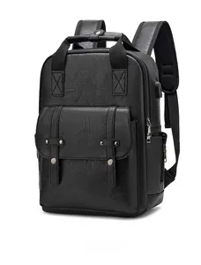 Detail showing side USB charging port and premium leather texture on vintage black backpack