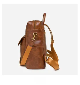 Detail view of brown PU leather backpack side with adjustable straps and golden zippers