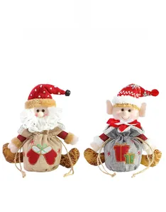Detail of drawstring Christmas gift bags with Santa and Elf plush character designs