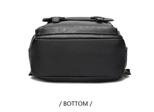 Detailed bottom view of large black leather backpack showing durable curved base construction