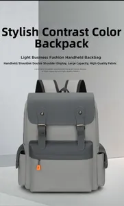 Front detail of vintage grey backpack featuring flap cover and orange zipper accents