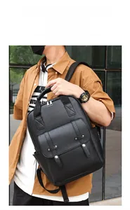 Detailed view of black faux leather backpack with metallic rivets and textured finish