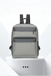 Detail of minimalist lightweight backpack with grey color-blocking and front zip pockets