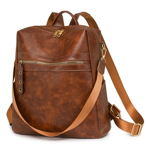Brown vintage faux leather backpack for women with wide straps and gold hardware details