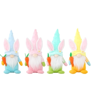 Set of four colorful Easter gnome plush dolls with bunny ears holding carrots for decor
