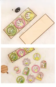 Detailed view of colorful wooden Easter ornaments featuring bunnies and chicks in a wood box