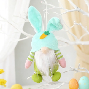 Easter bunny gnome pendant with mint green ears and orange carrot hanging on a white branch