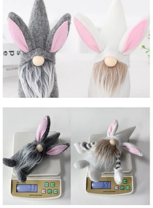 Detail view of plush Easter gnome with long bunny ears and weight measurement display