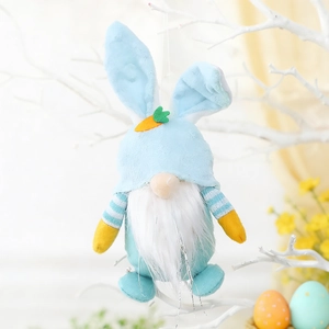 Close-up of Easter gnome plush with bunny ears and carrot detail on white branch