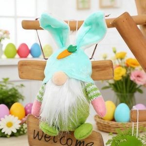 Detailed view of an Easter bunny gnome plush with light blue ears and felt carrot accent