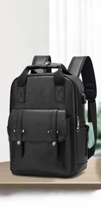 Detail of black pebbled PU leather backpack with USB port and stylish double buckle straps