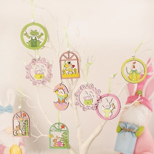 Easter wooden ornaments set with colorful rabbits and chicks hanging on white branches