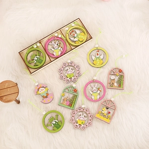 Easter wooden ornaments set with bunnies and chicks in a gift box on plush background