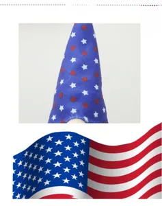 Close-up of patriotic gnome plush showing blue fabric with white and red star patterns