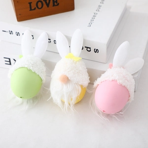 Three colorful Easter faceless gnome plushies with bunny ears and egg shaped bodies
