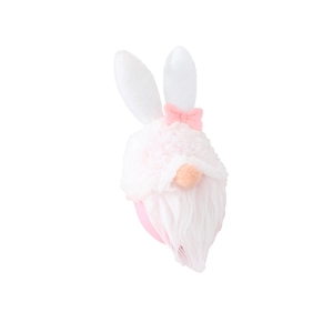 Easter gnome plush decoration with rabbit ears and pink bow on white background
