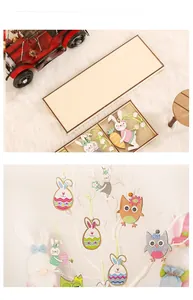 Detail view of painted Easter bunny wooden pendants hanging on a decorative tree branch