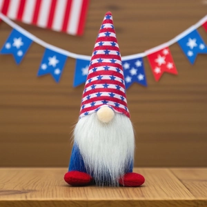 Patriotic 4th of July gnome decoration with stars and stripes on a wooden surface