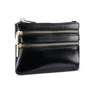 Classic black oil wax leather wallet with triple gold zippers shown from a side view