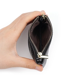 Minimalist black oil wax leather coin purse with double gold zipper and brown lining