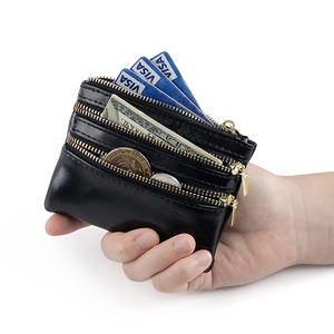 Black leather multi-zipper wallet featuring three compartments for cards and coins