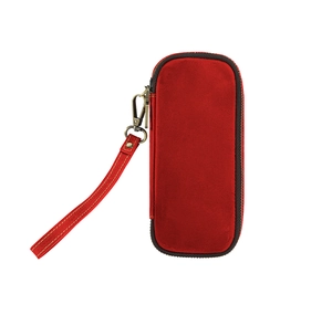 Macro detail of red suede leather storage bag with zipper and bronze metal wristlet hook