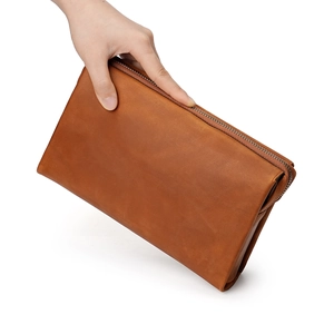 Vintage bruine heren clutch van crazy horse leer met metalen ritssluiting