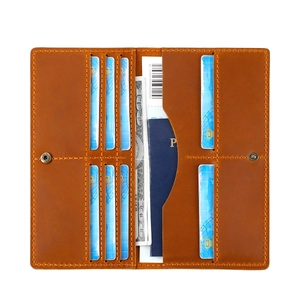Detailed interior of brown leather passport wallet showing card slots and money pockets