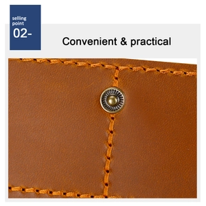 Macro detail of crazy horse leather wallet with copper snap button and orange stitching