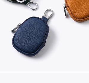 Litchi pattern genuine leather coin pouches in navy, brown, and green with silver hooks