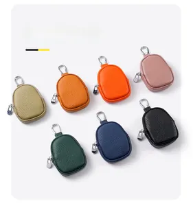 Detailed display of mini leather purses in seven colors with lychee texture and metal clips