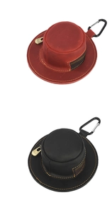 Detail of red and black hat-shaped leather coin purses with zipper and carabiner