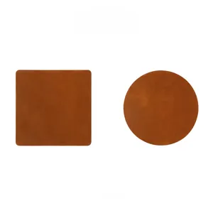 Detailed view of square and round brown crazy horse leather heat-resistant coasters