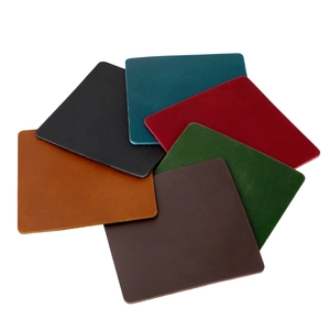 Close-up of stacked thick crazy horse leather coasters in six assorted classic colors