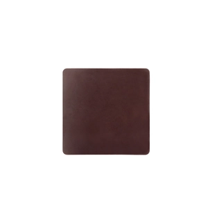 Close-up of dark brown crazy horse leather placemat with square rounded corners