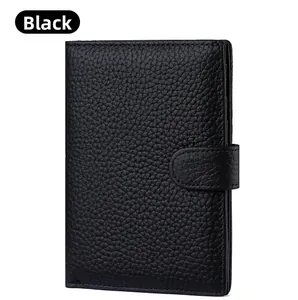 Detail of black pebbled leather texture on RFID passport wallet with side buckle closure
